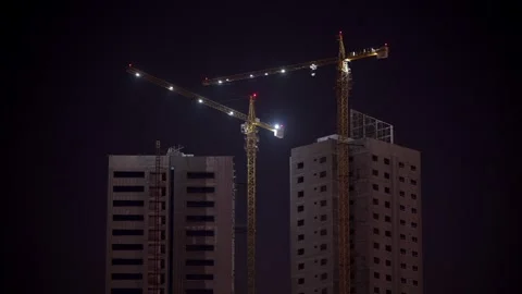 Cranes are installed on a skyscraper under construction in the UAE Stock Footage 334273824