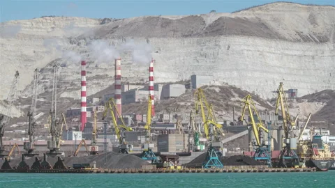 The cranes are loading bulk materials and coal in the seaport. Stock Footage 171528214