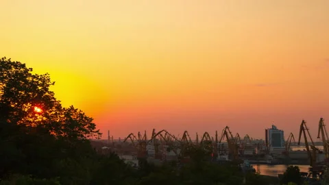 Cranes are Working in the Port at Sunset. Time Lapse 4K Видео 106465810