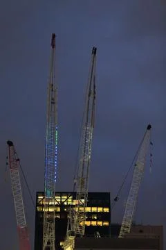 Cranes atop buildings under constuction on the CBD at nighy. Melbourne-AUS Stock Photos