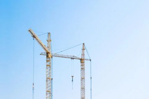 Cranes on blue sky Stock Photos