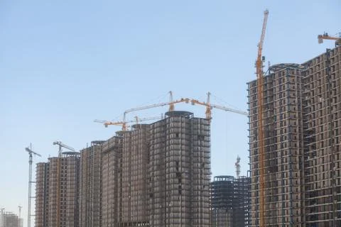 Cranes building a block Stock Photos