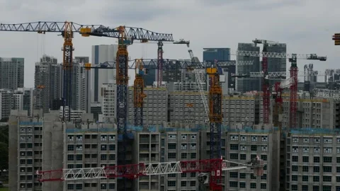 Cranes at a building site in a city development working on a high rise apartment Stock Footage 331152834