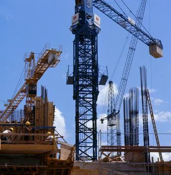 Cranes on the building site structural engineering house building building Stock Photos