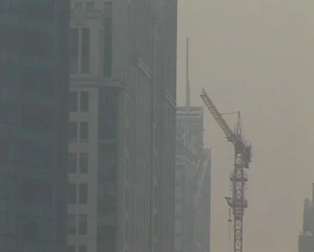 Cranes constructing buildings under pollution Stock Footage 285257