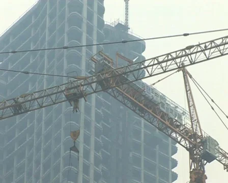 Cranes constructing buildings under pollution Stock Footage 285350