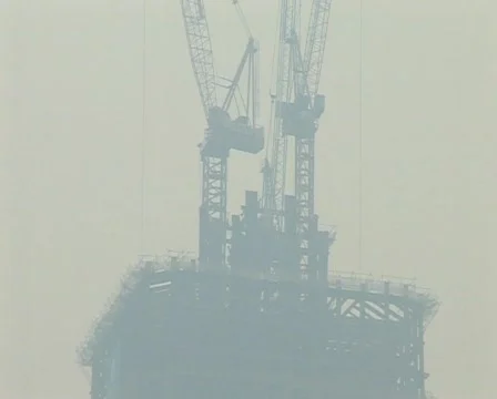 Cranes constructing buildings under pollution Stock Footage 285355