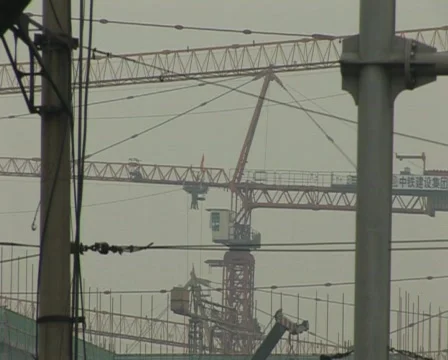 Cranes constructing buildings under pollution Stock Footage 285366