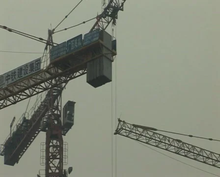 Cranes constructing buildings under pollution Stock Footage 285369