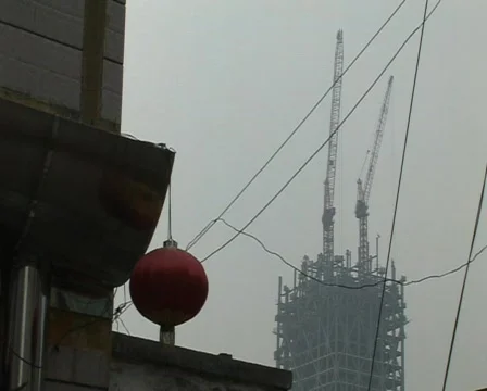 Cranes constructing buildings under pollution Stock Footage 337436