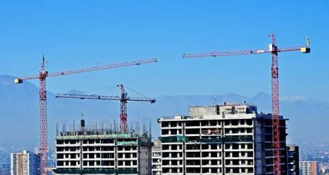 Cranes at construction building Stock Photos
