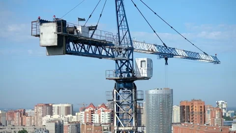 Cranes, construction crane equipment over building. technology transportation Stock-Footage 130885422