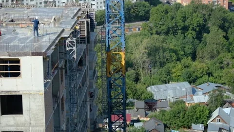 Cranes, construction crane equipment over building. technology transportation Stock Footage 153251386