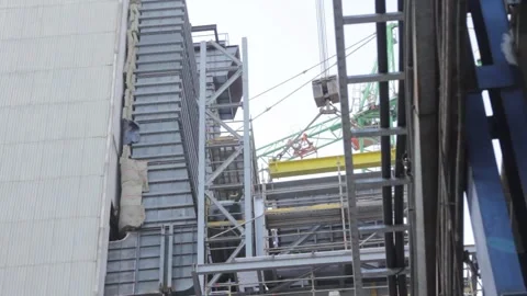Cranes at the construction site of the coal-fired power station Stock Footage 137576528