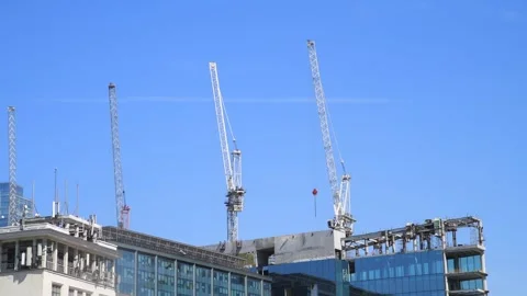 Cranes on construction site of modern building Stock Footage 276328896