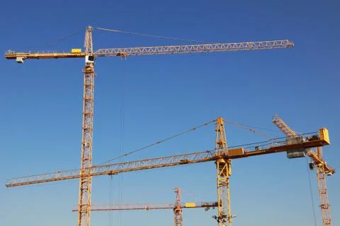 Cranes on a construction site Stock Photos