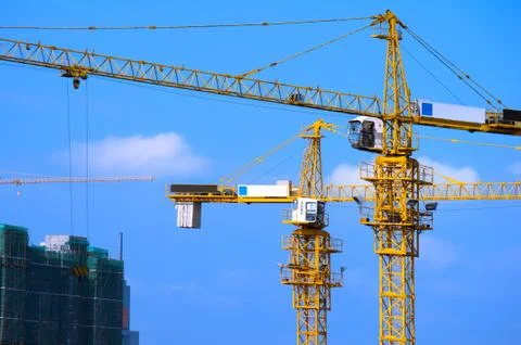 Cranes on construction site Stock Photos
