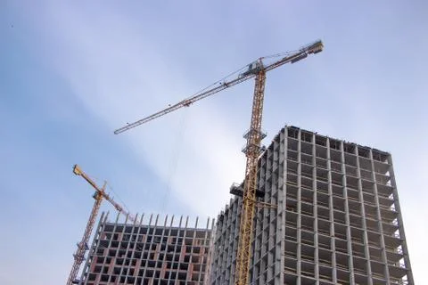Cranes on construction site. Stock Photos