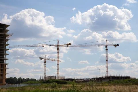 Cranes on a construction site Stock Photos
