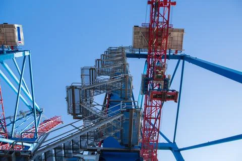 Cranes of container terminal cose up in industrial sea port. industrial port  Stock Photos