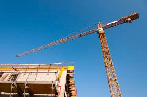 Cranes at developing the building Stock Photos