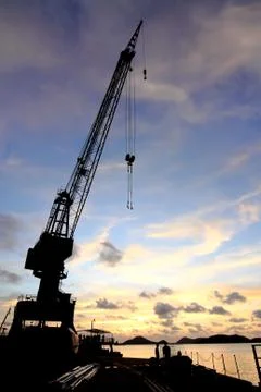 Cranes in dockside at sunset Foto stock