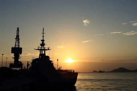 Cranes in dockyard  at sunset Stock Photos