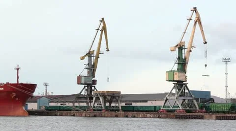 Cranes at harbour with train passing by Stock Footage 10883111