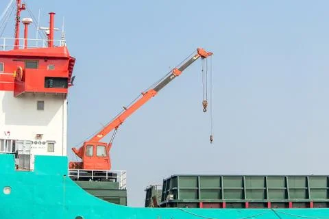 Cranes, lifting and placing of the load. Stock Photos