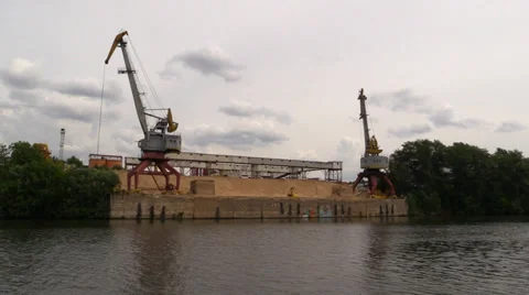 Cranes for loading sand on the river bank Stock Footage 39666862