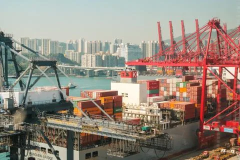 Cranes loading shipping container on freight harbor logistics centre in Hong  Stock Photos