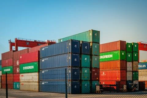Cranes loading shipping container on freight harbour logistics centre in Hong Stock Photos