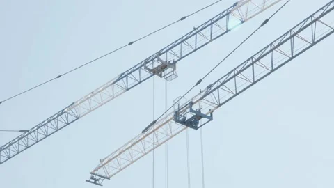 Cranes move in sync at a construction site Stock Footage 132493269