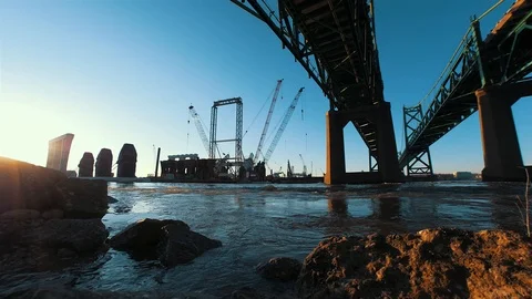 Cranes Moving and Building Bridge at Sunrise Timelapse Stock Footage 105066384