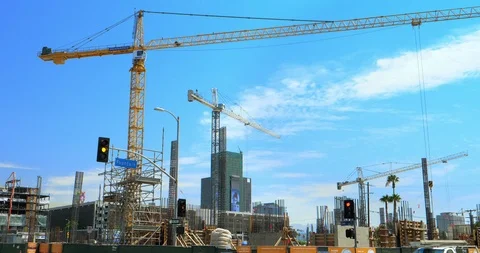 Cranes moving at development site during construction boom in Los Angeles, 4K Stock Footage 93261320