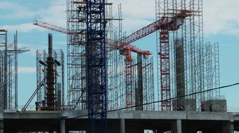 Cranes  operate on the building construction Stock Footage 62906071