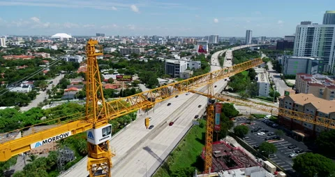 Cranes over the highway in Miami Stock Footage 157257078
