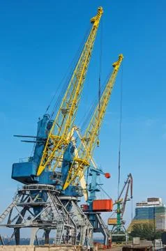 Cranes in river port Stock Photos