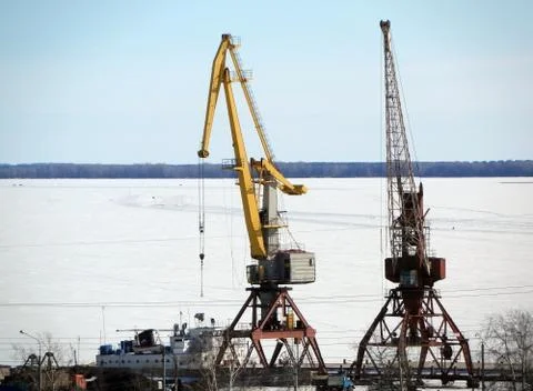 Cranes in river port Stock Photos