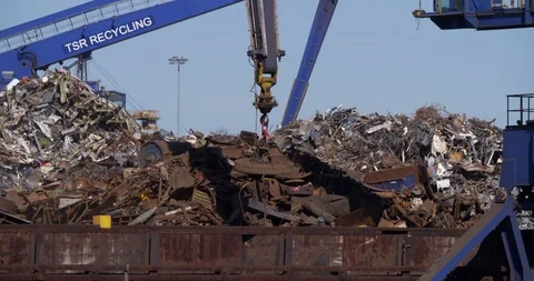 Cranes sorting heap of old scrap metal, recycling Germany Stock Footage 87421465