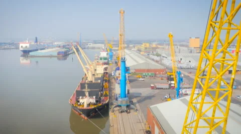 Cranes unloading Hull Port, UK, filmed by drone Stock Footage 61741200