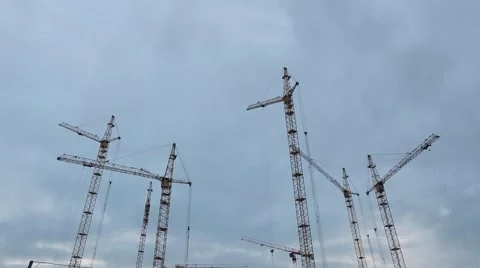 Cranes working on a building site Stock Footage 68198082