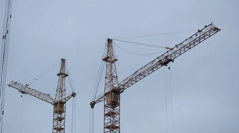 Cranes working on a building site Stock Footage 68200904
