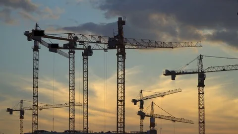 Cranes working on construction of the housing estate in former industrial zon Stock Footage 78699800