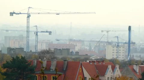 Cranes working on the construction site Stock Footage 69072229