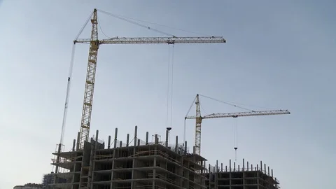 Cranes working at a construction site Stock Footage 88601436