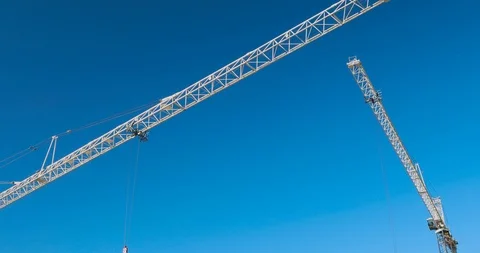 Cranes Working at the Construction Site Stock Footage 122974571
