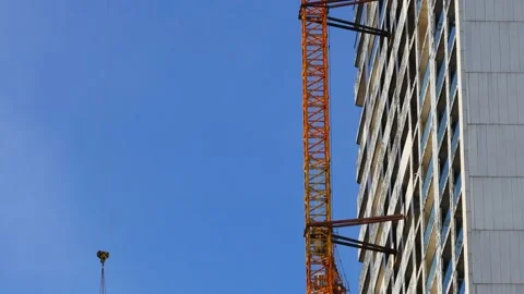 Cranes working on the construction site Stock Footage 236536782