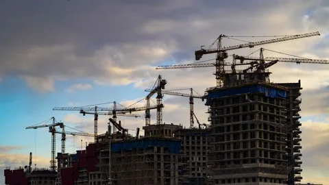 Cranes working day and night on construction of the housing estate in former  Video stock 175197344