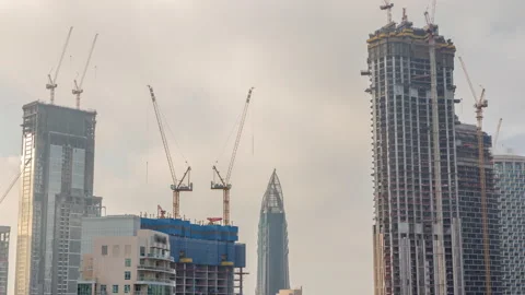 Cranes working on modern constraction site works of new skyscraper timelapse Stock Footage 157392248